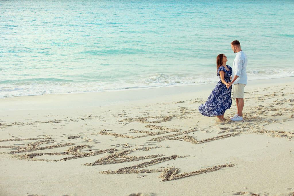 marry me writing on beach